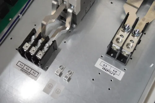 NAPCco TritonPro Maxx TPX digital phase converter interior showing T1 T2 T3 output and L1 L2 input power distribution blocks